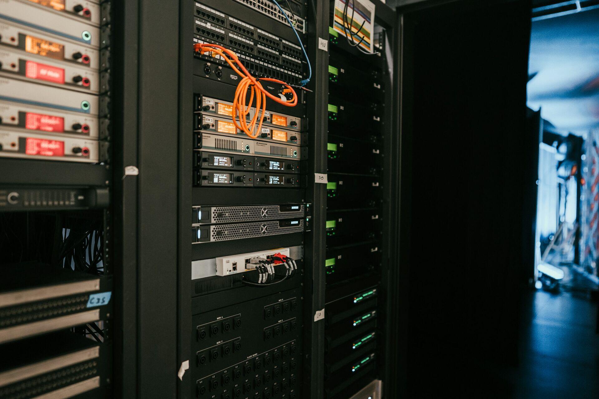 Technician working at server racks inside a national data center in Nigeria