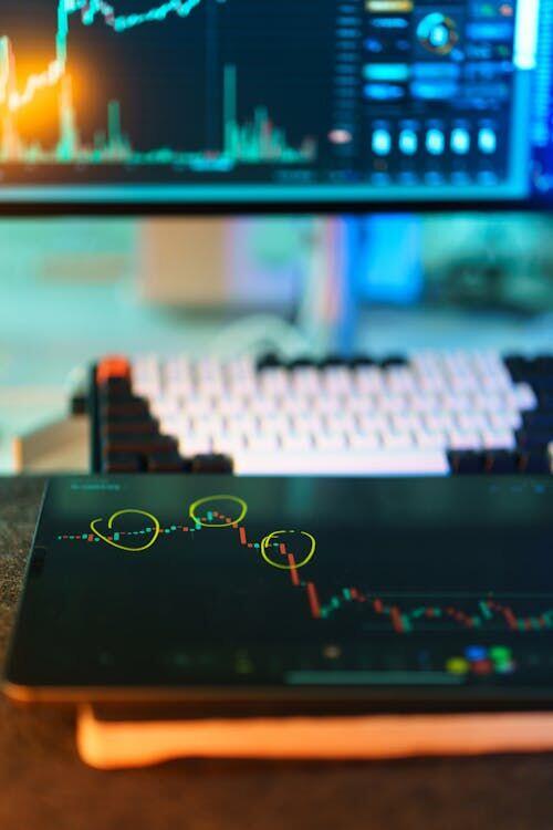 Row of analysts seated at screens displaying waveforms and signal data in a dimly lit operations centre